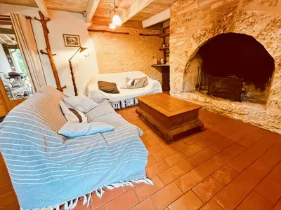 Un ou plusieurs lits dans un hébergement de l'établissement Maison chaleureuse au coeur de la nature Montignac Lascaux Dordogne 4 pers