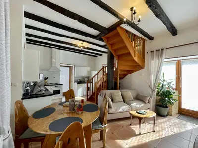 Coin salon dans l'établissement Le Clos de la Musardise - Gîtes de Charme avec Piscine Chauffée