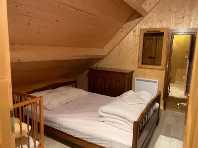 Un ou plusieurs lits dans un hébergement de l'établissement Chalet montagnard Perce Neige avec terrasse plein sud-5 personnes