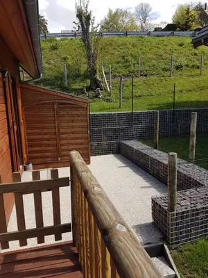Jardin de l'établissement Chalet montagnard Perce Neige avec terrasse plein sud-5 personnes