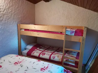 Un ou plusieurs lits dans un hébergement de l'établissement Appartement cosy et fonctionnel la Bourboule