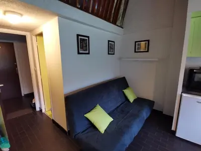 Coin salon dans l'établissement Appartement cosy et fonctionnel la Bourboule
