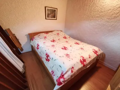 Un ou plusieurs lits dans un hébergement de l'établissement Appartement cosy et fonctionnel la Bourboule