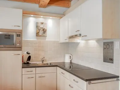Cuisine ou kitchenette dans l'établissement Le Lac Bleu nr 33