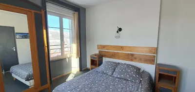 Un ou plusieurs lits dans un hébergement de l'établissement Grand Hotel de la Vallée