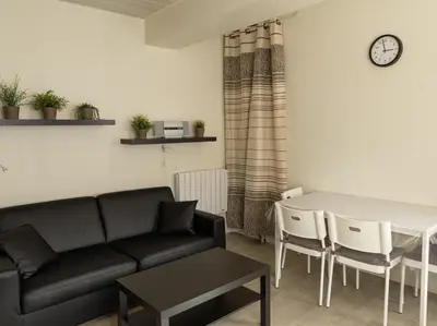Coin salon dans l'établissement Appartement Mont Dore face aux Thermes - Centre