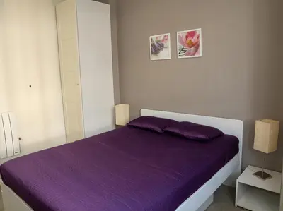 Un ou plusieurs lits dans un hébergement de l'établissement Appartement Mont Dore face aux Thermes - Centre