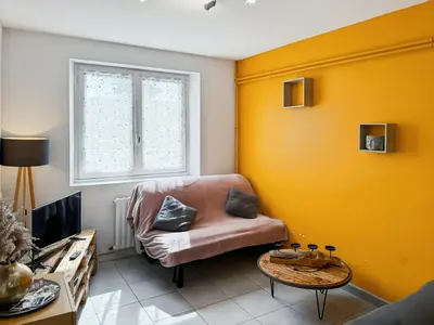 Coin salon dans l'établissement Logement de 40m2 de plein pieds dans une maison avec parking et terrasse