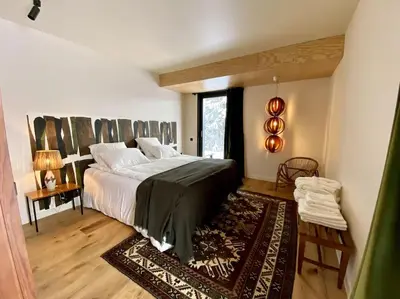 Un ou plusieurs lits dans un hébergement de l'établissement L'Avancée Chalet contemporain au coeur du Sancy AUVERGNE
