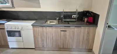 Cuisine ou kitchenette dans l'établissement maison d'hôte, gîte, la maisonnette