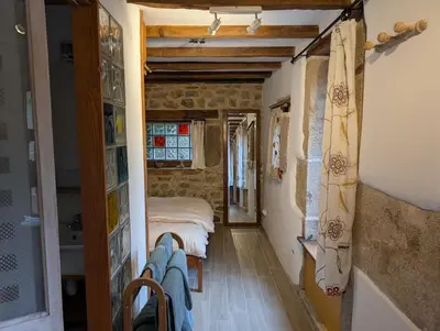 Un ou plusieurs lits dans un hébergement de l'établissement Gîte rustique au cœur de la nature