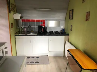 Cuisine ou kitchenette dans l'établissement Le studio d Antan
