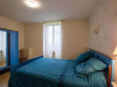 Un ou plusieurs lits dans un hébergement de l'établissement Gîte rural avec spa, animaux acceptés et parking - FR-1-616-246