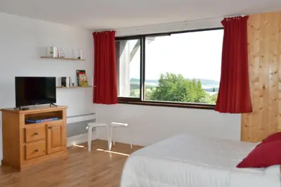 Un ou plusieurs lits dans un hébergement de l'établissement Grand studio 6 pers. Super Besse, Résidence ***