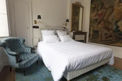 Un ou plusieurs lits dans un hébergement de l'établissement Hôtel de Colbert