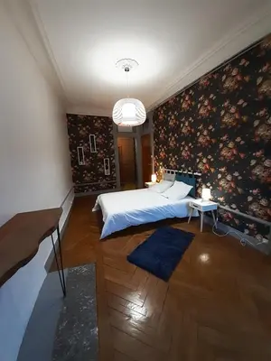 Un ou plusieurs lits dans un hébergement de l'établissement Tulle Centre : grand et bel appartement