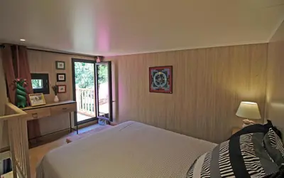 Un ou plusieurs lits dans un hébergement de l'établissement Le petit paradis, mini maison,nature,confort,calme