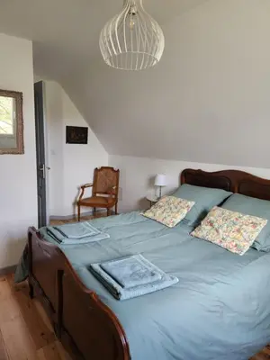 Un ou plusieurs lits dans un hébergement de l'établissement Gîte Le Petit Bois, près de Rocamadour, Padirac