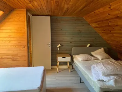 Un ou plusieurs lits dans un hébergement de l'établissement Appartement Duplex avec Wifi proche du centre