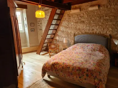 Un ou plusieurs lits dans un hébergement de l'établissement Maison du XVème au cœur du village médiéval