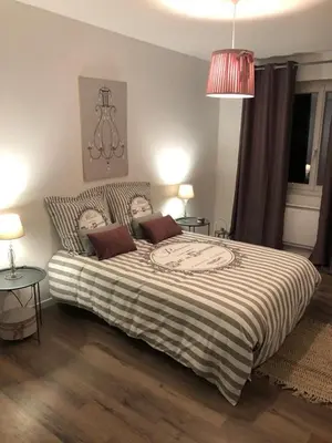Un ou plusieurs lits dans un hébergement de l'établissement Logement à Brive proche centre-ville et campagne - climatisation, Wifi, coin exterieur et parking privés