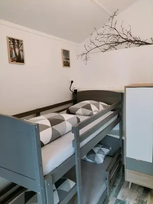 Un ou plusieurs lits dans un hébergement de l'établissement Au bord du lac