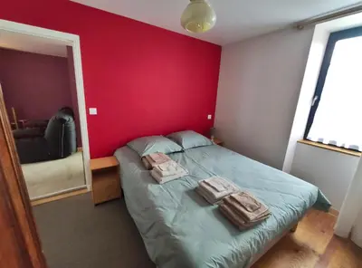 Un ou plusieurs lits dans un hébergement de l'établissement Le Cactus Orange Appartement 2 à 4 personnes avec entrée indépendante