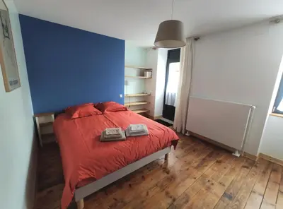 Un ou plusieurs lits dans un hébergement de l'établissement Le Cactus Orange Chambre d'hôte entrée indépendante