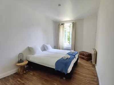 Un ou plusieurs lits dans un hébergement de l'établissement Charming and comfortable house