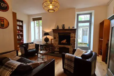 Coin salon dans l'établissement Charming and comfortable house
