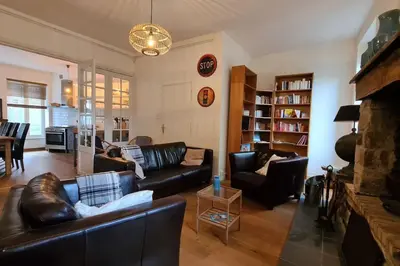 Coin salon dans l'établissement Charming and comfortable house