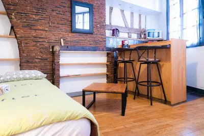 Un ou plusieurs lits dans un hébergement de l'établissement Studio 27 - 2eme etage