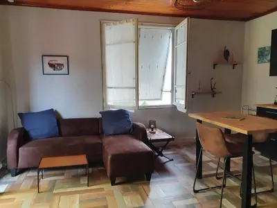 Coin salon dans l'établissement Le pigeonnier maison de caractère logement 4 personnes La maisonnette rénovée logement 2 personnes