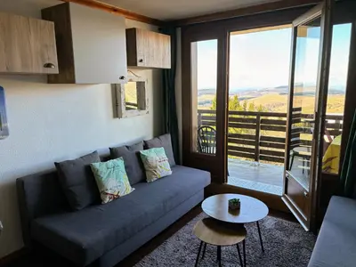 Coin salon dans l'établissement Lama-Gîte-des-Puys T3 Lamadalet, vue sud, terrasse, parking privé