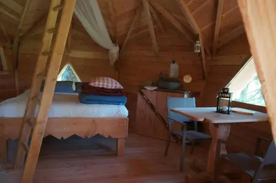 Un ou plusieurs lits dans un hébergement de l'établissement Cabanes des Volcans