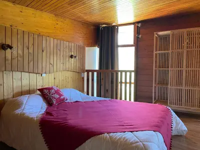 Un ou plusieurs lits dans un hébergement de l'établissement LE SAPORTA- Studios et Appartements meublés de tourisme