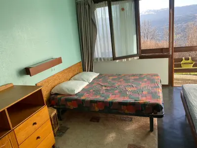 Un ou plusieurs lits dans un hébergement de l'établissement Duplex Superbe Vue Montagne