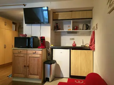 Cuisine ou kitchenette dans l'établissement Studio face au Thermes