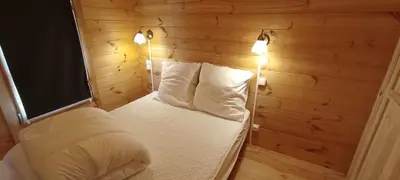 Un ou plusieurs lits dans un hébergement de l'établissement Les Chalets de La Vialette