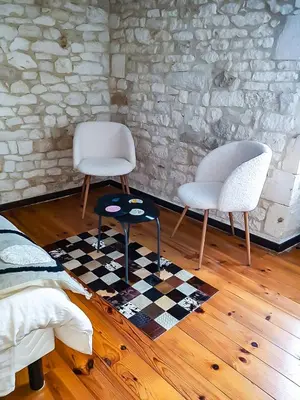 Coin salon dans l'établissement Les chambres du Roc