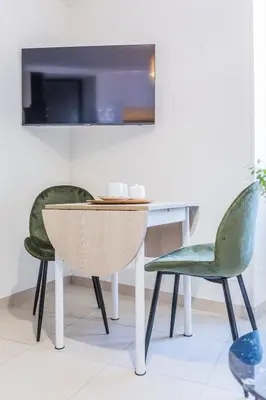 Télévision ou salle de divertissement dans l'établissement Maison Victoire