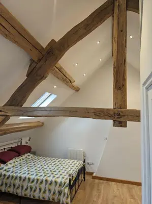 Un ou plusieurs lits dans un hébergement de l'établissement Trois Mousquetaires Gîte