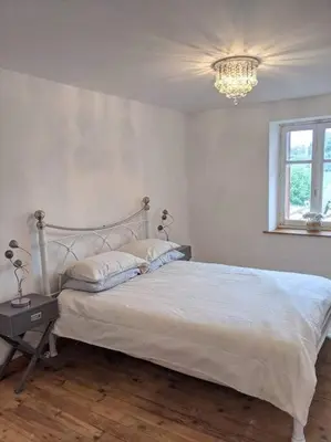 Un ou plusieurs lits dans un hébergement de l'établissement Trois Mousquetaires Gîte