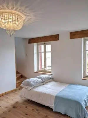 Un ou plusieurs lits dans un hébergement de l'établissement Trois Mousquetaires Gîte