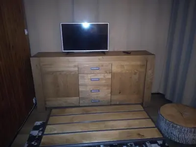 Télévision ou salle de divertissement dans l'établissement Un petit coin de paradis à Super Besse
