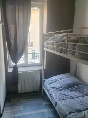 Un ou plusieurs lits dans un hébergement de l'établissement Bienvenue chez les ch'oups le loft 50 m2