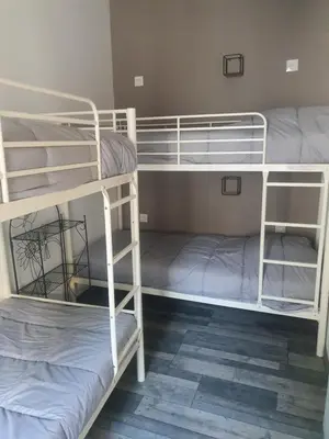 Un ou plusieurs lits dans un hébergement de l'établissement Bienvenue chez les ch'oups le loft 50 m2