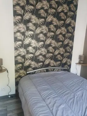 Un ou plusieurs lits dans un hébergement de l'établissement Bienvenue chez les ch'oups le loft 50 m2