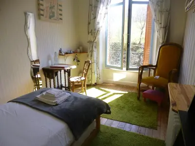 Un ou plusieurs lits dans un hébergement de l'établissement La Maison Du Marchand