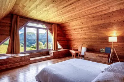 Un ou plusieurs lits dans un hébergement de l'établissement L'Impradine, grand gîte vue et nature splendides